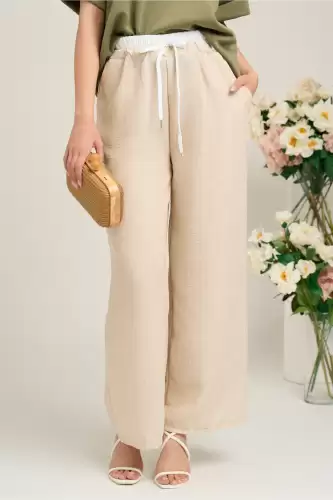 Pantaloni casual vaporosi bej cu banda alba si elastic in talie